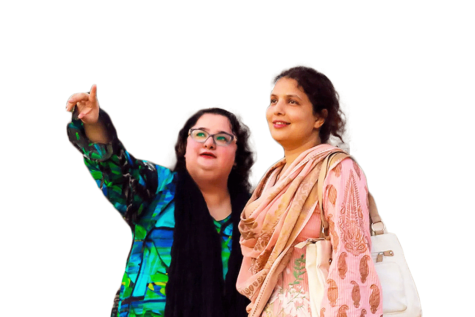 Two women looking up with one pointing upwards