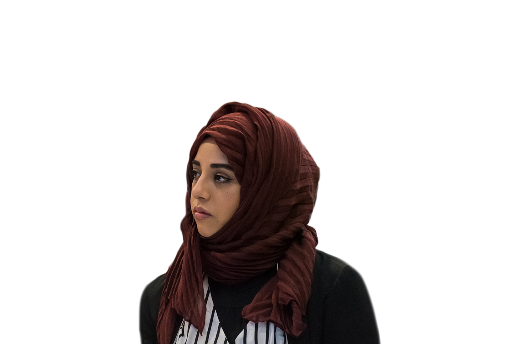 Woman from the Middle East in a brown headscarf.