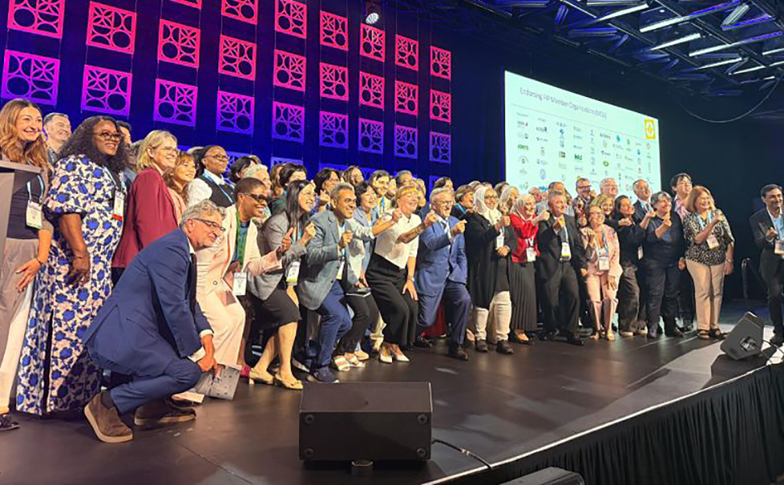 Supporters of Montreal Declaration on NCDs standing on a state at the 2026 FIP World Congress (84th), Montreal, 30 August–2 September 2026.