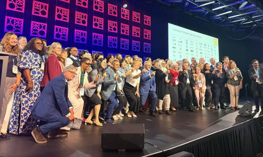 Supporters of Montreal Declaration on NCDs standing on a state at the 2026 FIP World Congress (84th), Montreal, 30 August–2 September 2026.